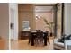 Bright dining room with brick accent wall and large windows at 1281 Avalon Ne Pl, Atlanta, GA 30306