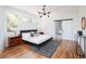 Spacious bedroom with hardwood floors and a barn door at 1281 Avalon Ne Pl, Atlanta, GA 30306