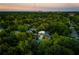 Aerial view showcasing a modern home nestled in a tree-lined neighborhood at 1281 Avalon Ne Pl, Atlanta, GA 30306