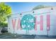 A mural on a building in the Yahi neighborhood with birds and a tree design at 1281 Avalon Ne Pl, Atlanta, GA 30306