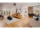 Open-concept living room with hardwood floors and modern furniture at 1281 Avalon Ne Pl, Atlanta, GA 30306