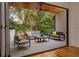 Spacious outdoor patio with modern furniture and serene wooded views at 1281 Avalon Ne Pl, Atlanta, GA 30306