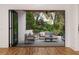 View through multi-panel doors shows a large patio and backyard at 1281 Avalon Ne Pl, Atlanta, GA 30306