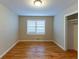 Bright bedroom with hardwood floors and a large closet at 6234 Melrose St, Douglasville, GA 30134