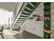 Modern metal staircase with sleek railing and built-in shelving at 400 17Th Nw St # 2431, Atlanta, GA 30363