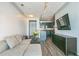 Open living room with sectional sofa, modern decor, and kitchen view at 400 17Th Nw St # 2431, Atlanta, GA 30363