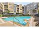 Refreshing community pool with lounge chairs and inflatables at 400 17Th Nw St # 2431, Atlanta, GA 30363
