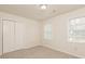 Simple bedroom with double door closet and two windows at 1851 Furlong Run, Lawrenceville, GA 30043