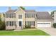 Two-story house featuring a large attached garage at 1851 Furlong Run, Lawrenceville, GA 30043