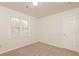 Well-lit bedroom with closet and window at 1851 Furlong Run, Lawrenceville, GA 30043
