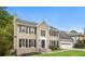 Tan brick two story house with black shutters at 1851 Furlong Run, Lawrenceville, GA 30043
