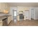 Kitchen boasts granite countertops and ample cabinet space at 1851 Furlong Run, Lawrenceville, GA 30043