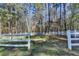 Spacious, fenced backyard surrounded by trees at 2701 Stilesboro Nw Ln, Acworth, GA 30101