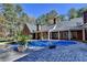 Covered in-ground pool with brick patio and mature trees at 2701 Stilesboro Nw Ln, Acworth, GA 30101
