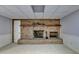 Cozy basement area with a brick fireplace and ample space for relaxation at 2701 Stilesboro Nw Ln, Acworth, GA 30101
