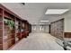 Expansive basement library with built-in bookshelves, carpeted floors, and ample natural light at 2701 Stilesboro Nw Ln, Acworth, GA 30101