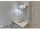 Clean bathroom with a large vanity, mirror, and white fixtures at 2701 Stilesboro Nw Ln, Acworth, GA 30101