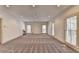 Spacious bonus room with gray carpeting and large window views at 2701 Stilesboro Nw Ln, Acworth, GA 30101