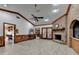 Gathering room with brick fireplace, tile floors, ceiling fan, and access to backyard at 2701 Stilesboro Nw Ln, Acworth, GA 30101