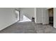 Living room with plush gray carpet and large windows offering natural light at 2701 Stilesboro Nw Ln, Acworth, GA 30101