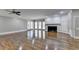 Large living room with hardwood floors, a fireplace, and built-in cabinetry at 2701 Stilesboro Nw Ln, Acworth, GA 30101