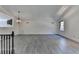 Bright living room with vaulted ceilings and gray wood-look flooring at 2701 Stilesboro Nw Ln, Acworth, GA 30101