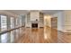 Spacious living room with hardwood floors, fireplace, built-in shelves, and ample natural light at 2701 Stilesboro Nw Ln, Acworth, GA 30101