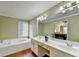 Bathroom features a large garden tub and double vanity at 3034 Brookgreen Trl, Lawrenceville, GA 30043