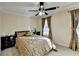 Spacious bedroom with a dresser and patterned bedding at 3034 Brookgreen Trl, Lawrenceville, GA 30043