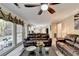 Gathering room with leather furniture, a large window and view of the kitchen at 3034 Brookgreen Trl, Lawrenceville, GA 30043