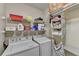 Laundry room with washer, dryer, and shelving for storage at 3034 Brookgreen Trl, Lawrenceville, GA 30043