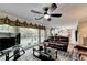 Gathering room with leather furniture, a large window and view of the kitchen at 3034 Brookgreen Trl, Lawrenceville, GA 30043