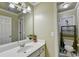 Bathroom with vanity, mirror, and access to a separate toilet area at 3034 Brookgreen Trl, Lawrenceville, GA 30043