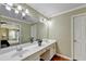 Double vanity bathroom with ample counter space and a large mirror at 3034 Brookgreen Trl, Lawrenceville, GA 30043