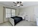 Bedroom with a white bed frame and built-in shelves at 3034 Brookgreen Trl, Lawrenceville, GA 30043
