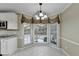 Bright kitchen features granite countertops and a view to the backyard at 3034 Brookgreen Trl, Lawrenceville, GA 30043