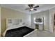 Bedroom with vanity, white bed frame, and carpeted floor at 3034 Brookgreen Trl, Lawrenceville, GA 30043