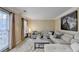 Spacious living room featuring a large sectional sofa and stylish rug at 3034 Brookgreen Trl, Lawrenceville, GA 30043