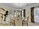 Elegant dining room with a round table and four chairs, featuring neutral colors at 3034 Brookgreen Trl, Lawrenceville, GA 30043