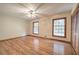 Spacious bedroom with hardwood floors and multiple windows at 810 Mcconnell Rd, Powder Springs, GA 30127