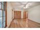 Spacious bedroom with hardwood floors and multiple windows at 810 Mcconnell Rd, Powder Springs, GA 30127