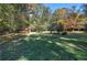Spacious backyard with storage shed and mature trees at 810 Mcconnell Rd, Powder Springs, GA 30127