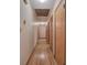 Long hallway with hardwood floors and light-colored walls at 810 Mcconnell Rd, Powder Springs, GA 30127
