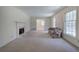 Living room with fireplace and view into dining room at 810 Mcconnell Rd, Powder Springs, GA 30127