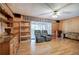 Spacious living room with hardwood floors, brick fireplace, and access to a sunroom at 810 Mcconnell Rd, Powder Springs, GA 30127