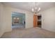 Bright dining room with chandelier and views to living room and kitchen at 810 Mcconnell Rd, Powder Springs, GA 30127