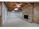 Finished basement showcasing a brick fireplace and open space at 810 Mcconnell Rd, Powder Springs, GA 30127