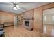 Living room featuring hardwood floors, a brick fireplace, and built-in shelving at 810 Mcconnell Rd, Powder Springs, GA 30127
