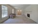 Spacious living room featuring a fireplace and large windows at 810 Mcconnell Rd, Powder Springs, GA 30127