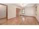 Hardwood floor bedroom with built-in closet and window at 810 Mcconnell Rd, Powder Springs, GA 30127
